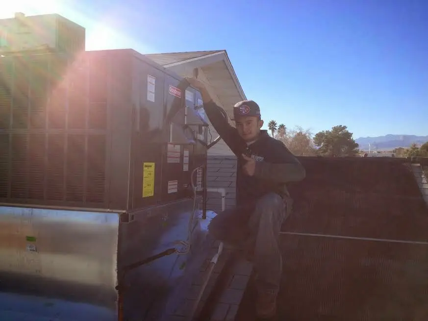 HVAC technician performing HVAC Inspection on a rooftop unit in Stroudsburg